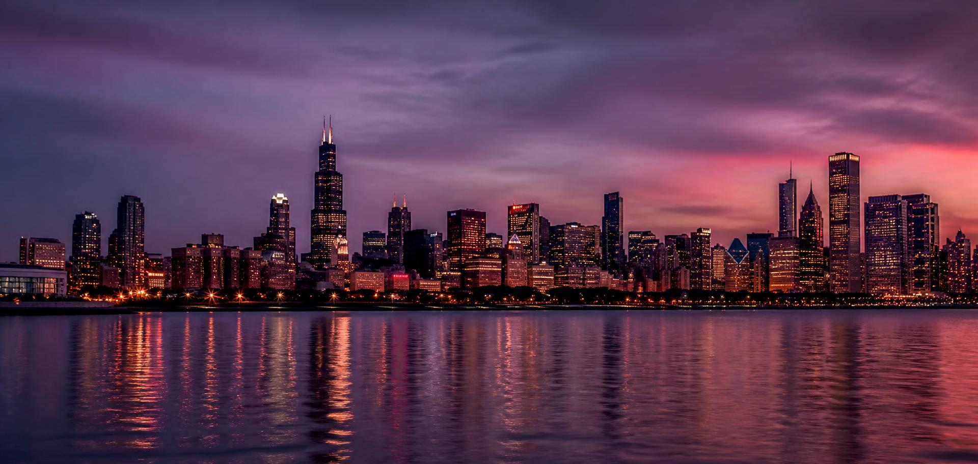 Chicago skyline reflected across Lake Michigan at dusk